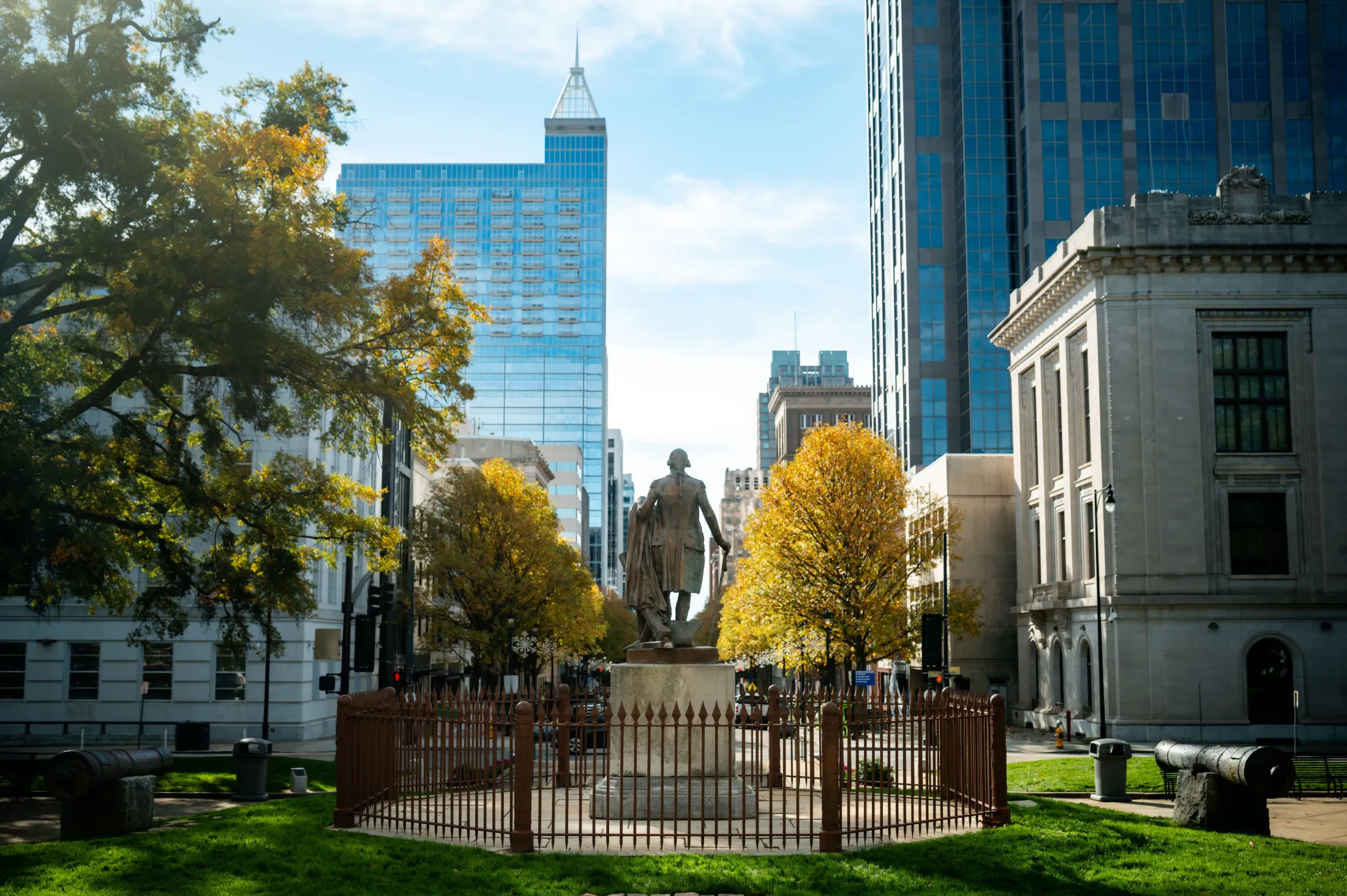 Fayetteville Street and the downtown Raleigh skyline on a sunny day